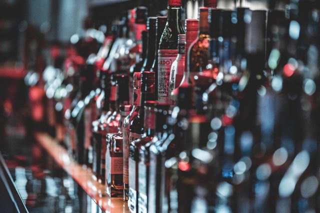 Selective Focus Photo Of Alcohol Bottles